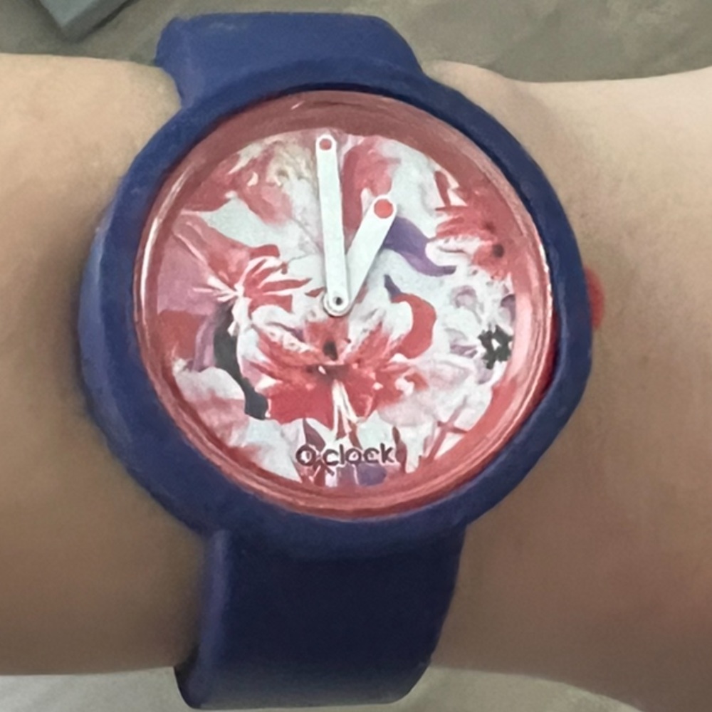 OCLOCK slip on watch ,size small. Purple rubber band with red and purple face.